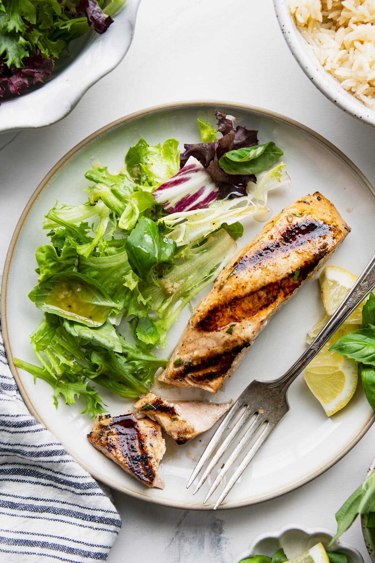 Overhead image of a piece of grilled salmon that's been flavored with the most delicious salmon marinade.