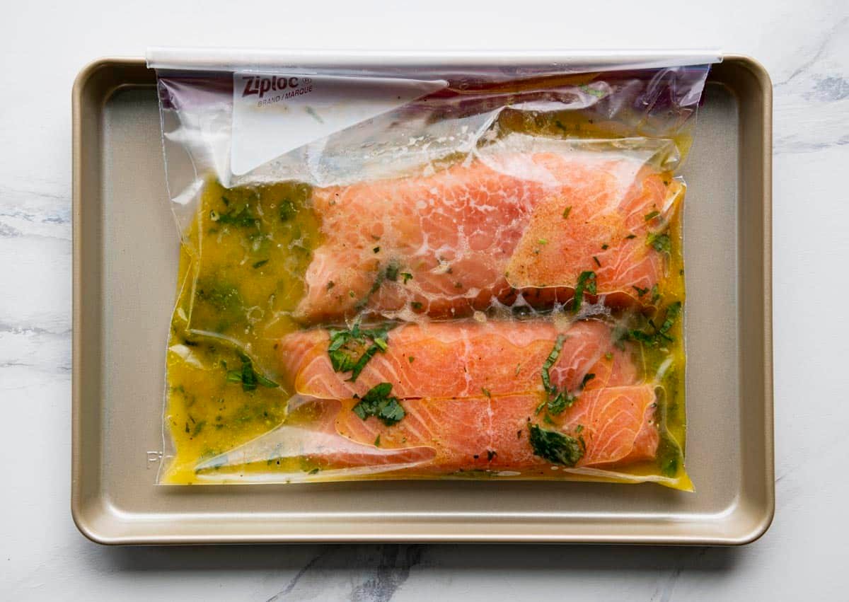 Salmon fillets in a Ziploc bag with a grilled salmon marinade.