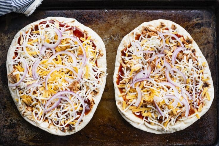 Process shot showing how to make bbq chicken pizza on flatbread.