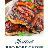 Grilled bbq pork chops with text title at the bottom.