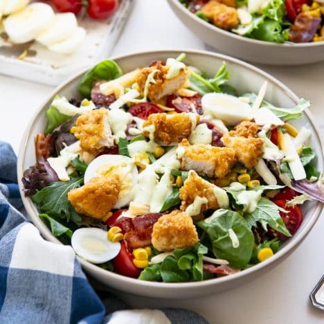 A homemade chick fil a cobb salad recipe served on a white table.