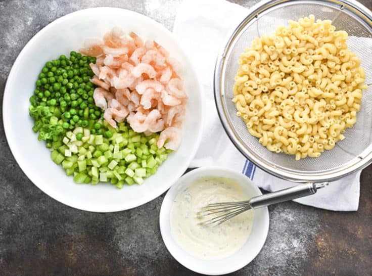Shrimp pasta salad ingredients on a table.