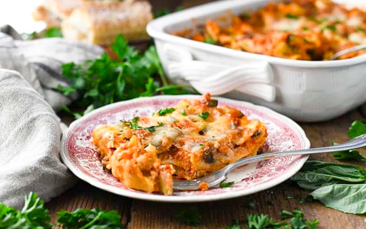 Horizontal side shot of Italian vegetarian lasagna on a plate.
