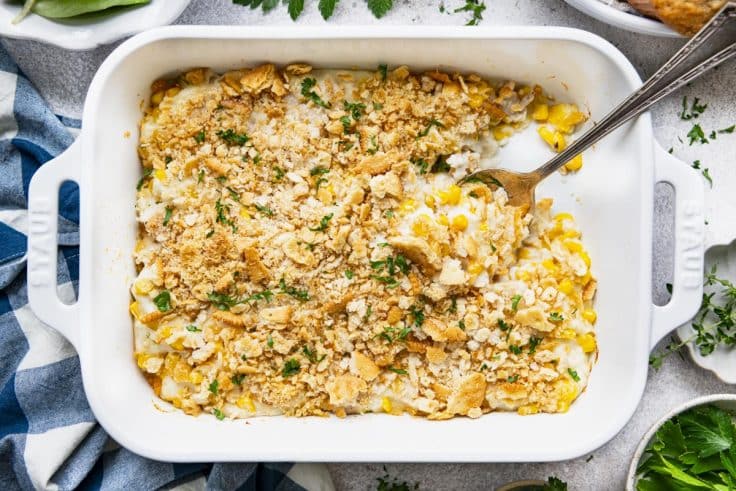 Horizontal overhead image of easy chicken casserole with corn in a white dish.