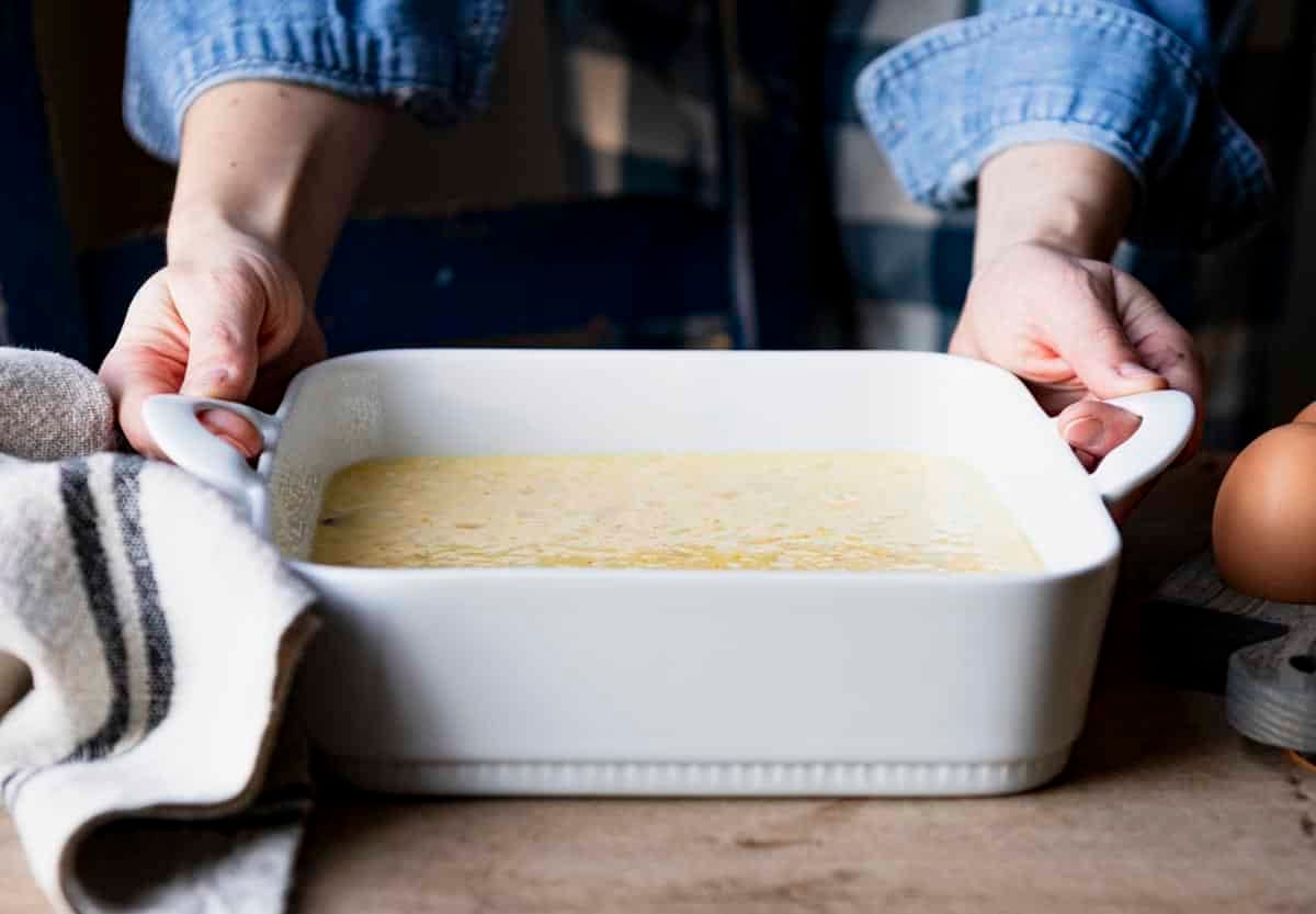 Process shot showing a western omelet in a baking dish before it goes in the oven.