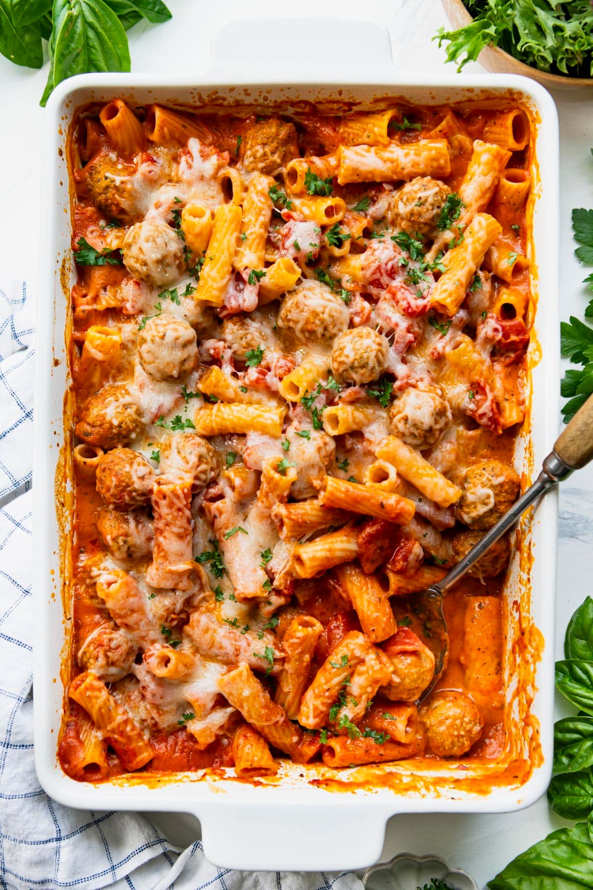 Overhead shot of creamy tomato pasta bake with turkey meatballs.