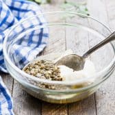 Pesto and mayo in a glass bowl.