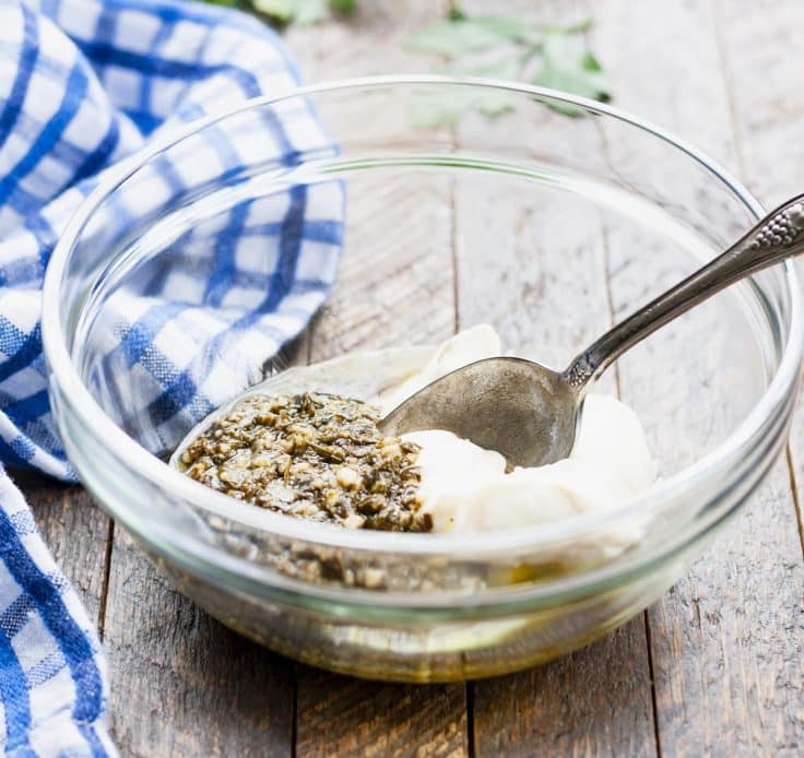 Pesto and mayo in a glass bowl.